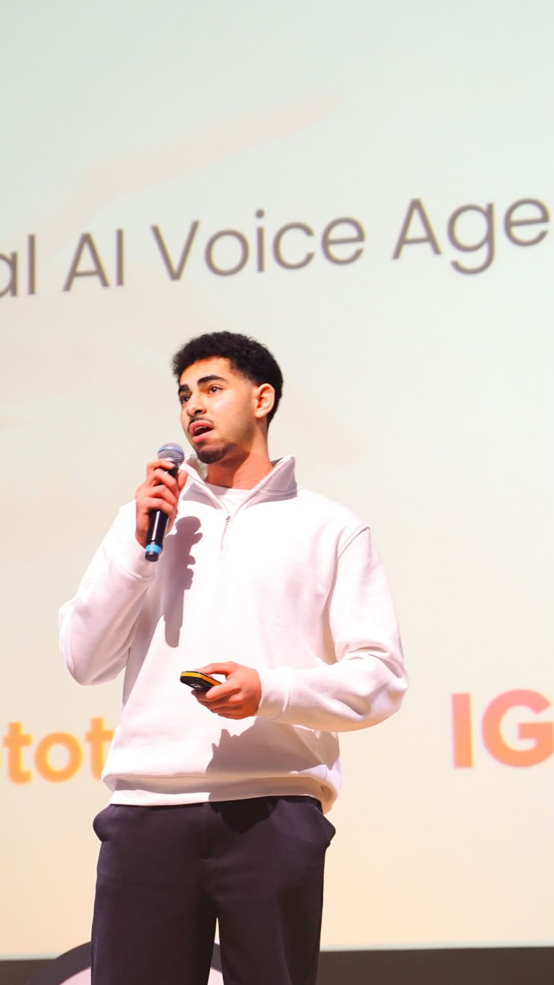 Nadim on stage pitching SVARA's AI voice agent