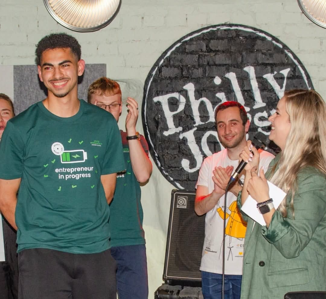 Nadim on stage with the Young Entrepreneurs Summer School team